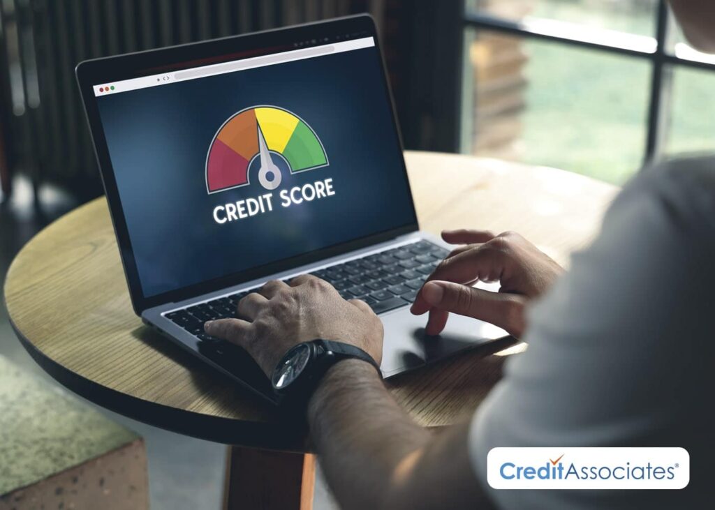 Checking credit score on laptop.